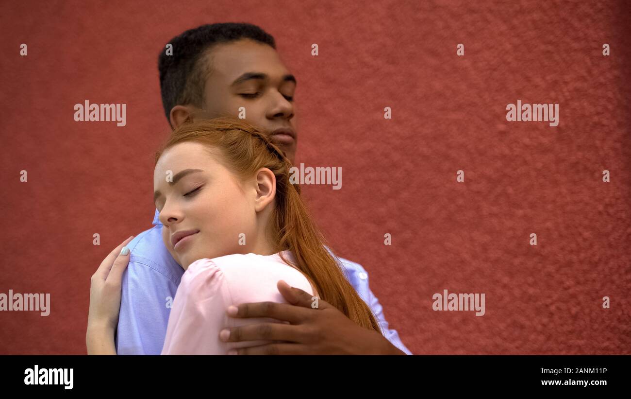 Cute Red Haired Girl Snuggling To Her Mixed Race Boyfriend Couple