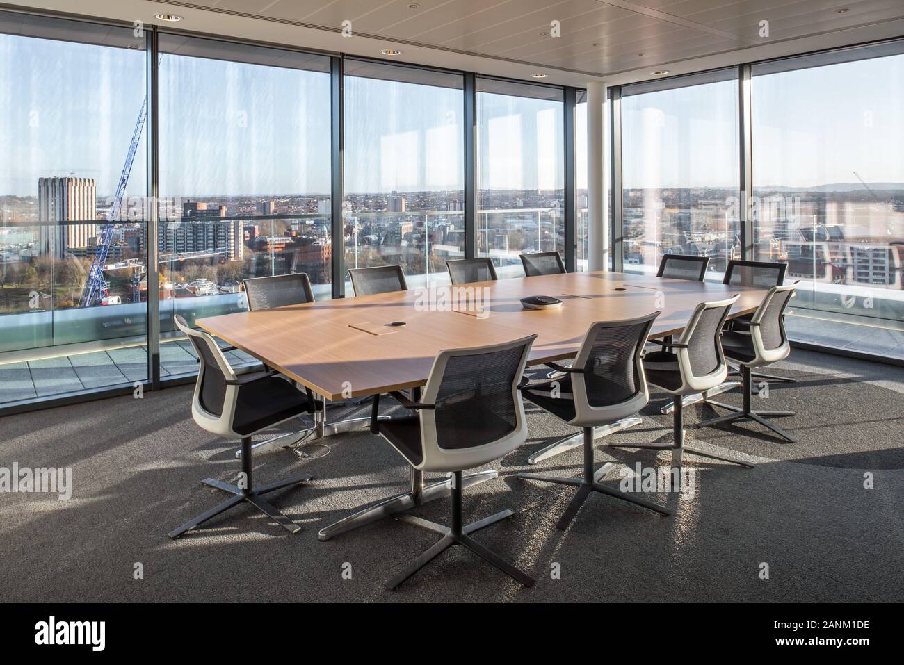 Boardroom overlooking city Stock Photo