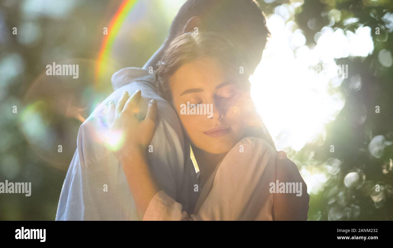 Teenage couple in love cuddling hi-res stock photography and images - Alamy