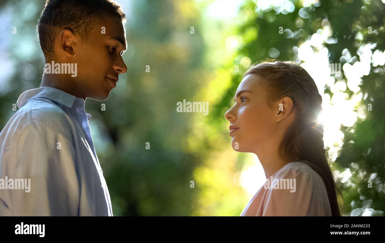 Teenage couple hugging in park hi-res stock photography and images - Alamy