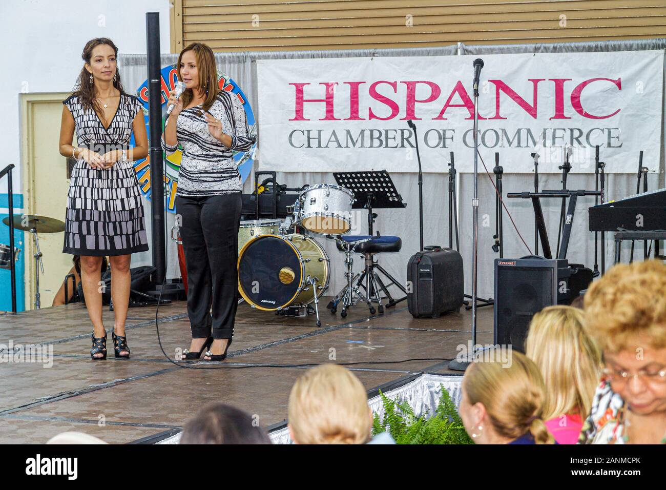Miami Florida,Doubletree Miami Mart,hotel,Center,centre,Hispanic business,Expo Festival,Chamber of Commerce,woman female women,speaking,stage,micropho Stock Photo