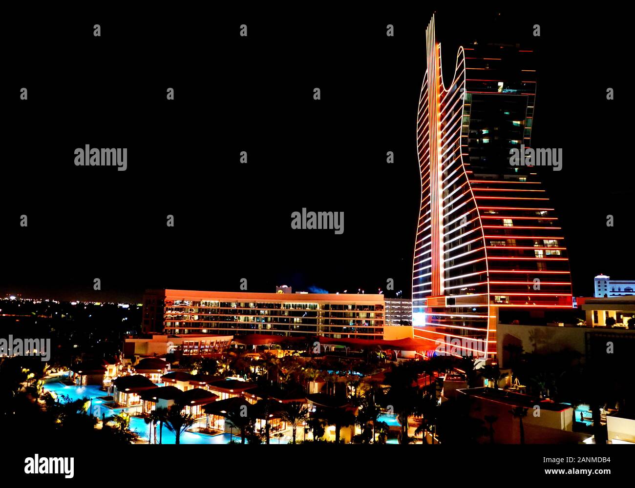Hollywood, Florida, U.S.A - January 3, 2020 - Seminole Hard Rock Hotel and Casino illuminated with red and yellow neon lights at night Stock Photo