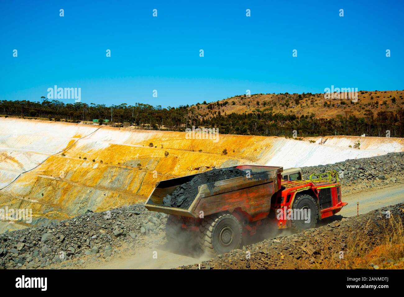 Mining Dump Truck in Open Pit Mine Stock Photo