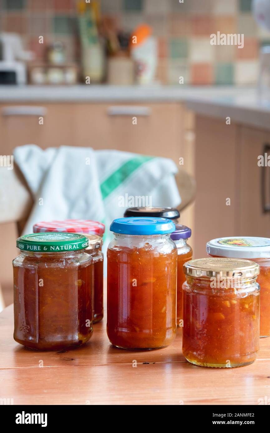 Homemade marmalade jars on a kitchen table Stock Photo