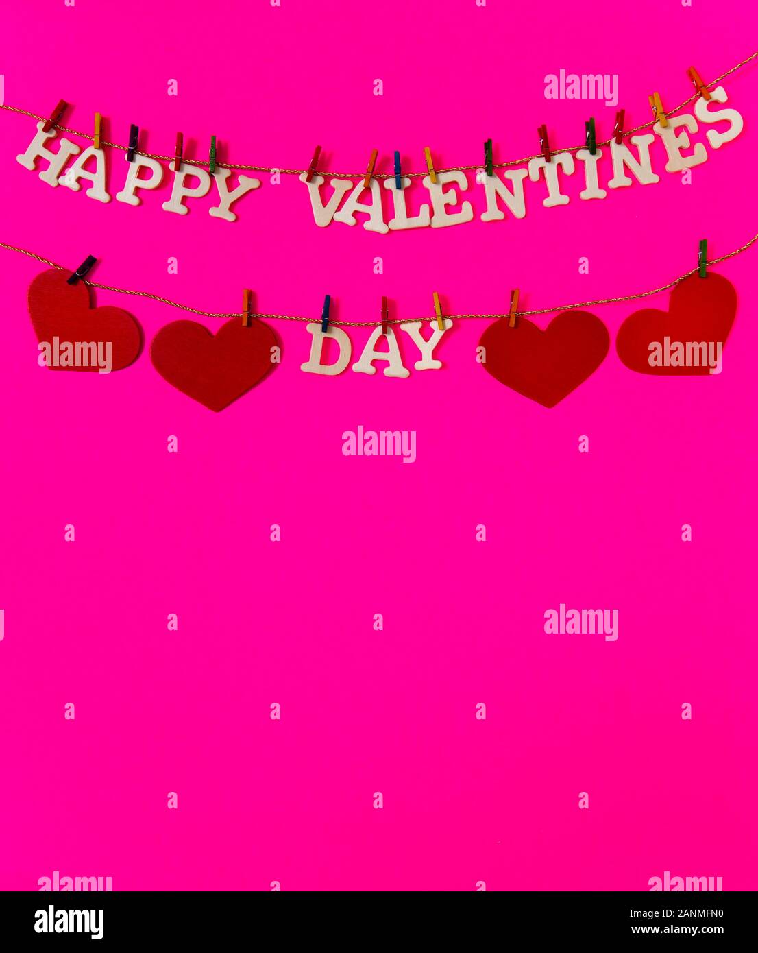 Happy Valentines Day with red hearts on a pink background with plenty ...