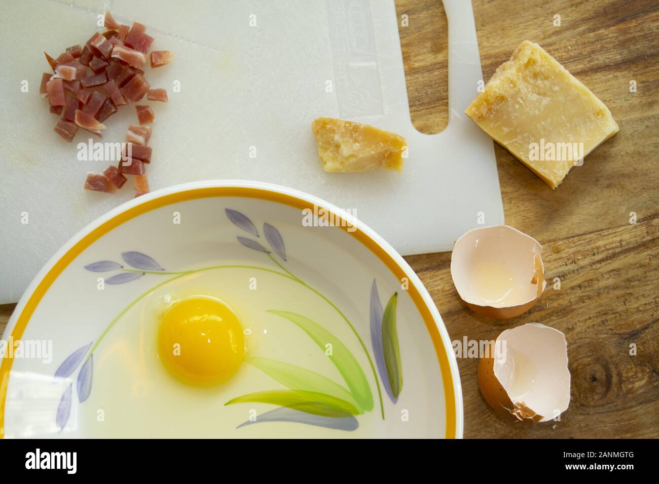 bacon parmesan cheese and egg to prepare carbonara pasta Stock Photo