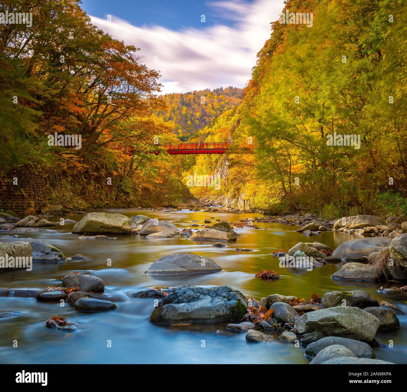 Autumn in Jozankei with Futami Suspension Bridge in background Stock Photo