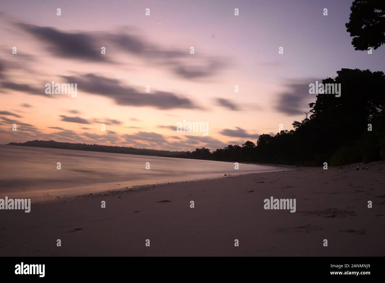 Early morning long exposure sea landscape with tree on shore of neil island at andaman and nicobar islands Stock Photo