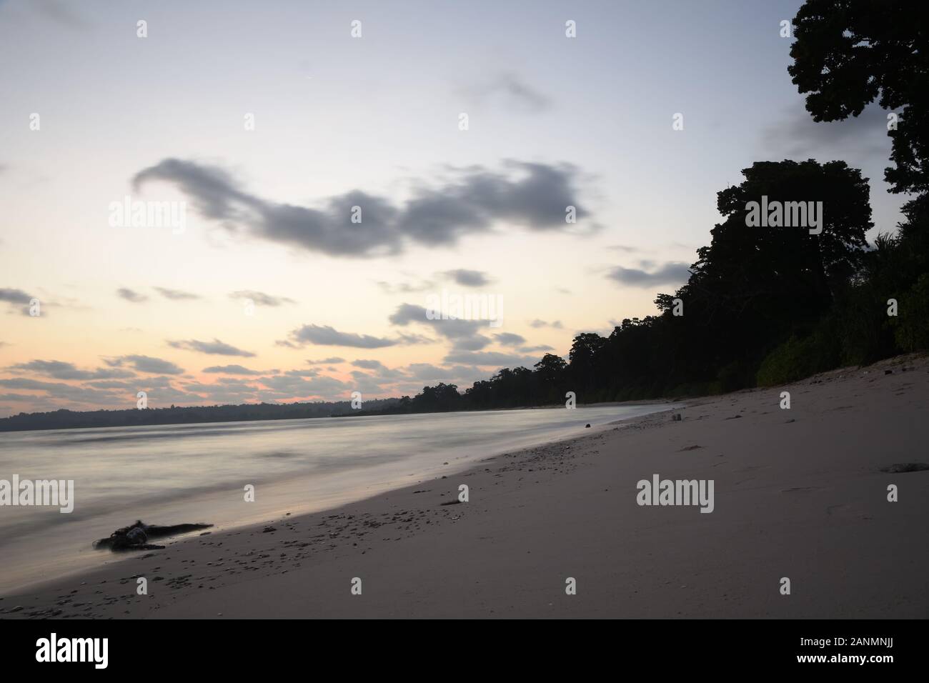 Early morning long exposure sea landscape with tree on shore of neil island at andaman and nicobar islands Stock Photo