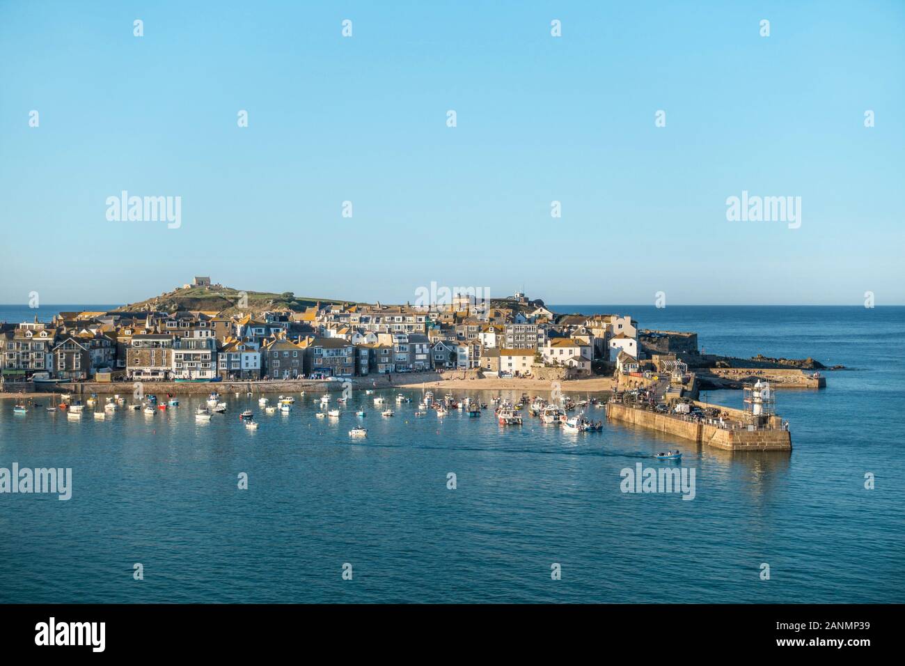 Aerial view of the Cornish seaside town, holiday resort and harbour of St. Ives in Cornwall in September with clear blue sky, England, UK Stock Photo