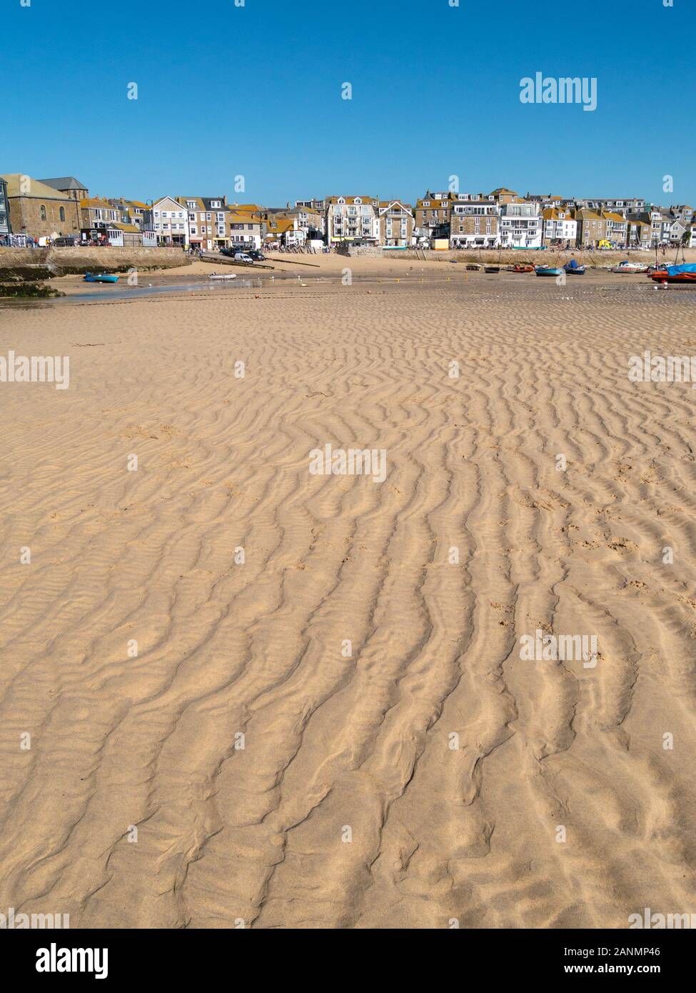 Rippled sand in St Ives Harbour at low tide in Summer with clear blue sky, St, Ives, Cornwall, England, UK Stock Photo