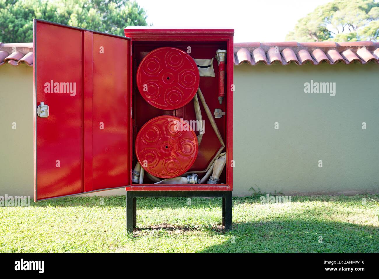 Fire Hose Reel Outdoors. Fire Safety Concept Stock Photo