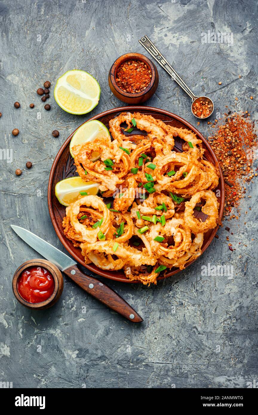 Crunchy deep fried squid rings in batter Stock Photo - Alamy