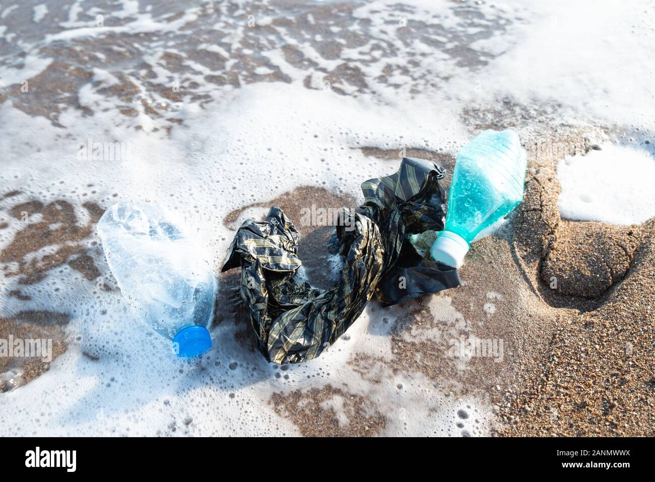 Used Plastic On Shore. Environmental Pollution Concept Stock Photo