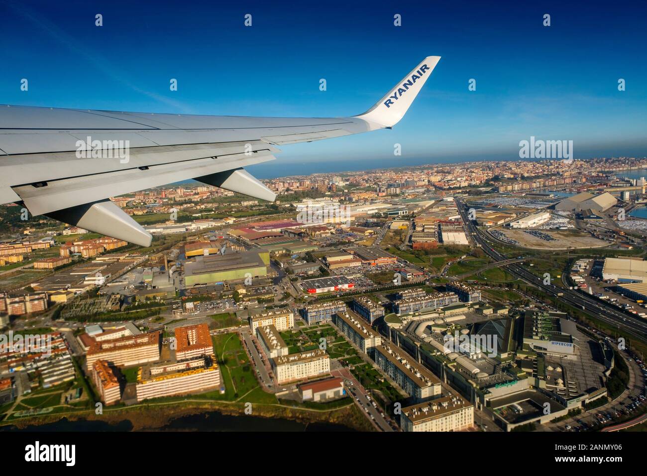 Plane flying over Santander, Cantabrian Sea. Cantabria, north Spain. Europe Stock Photo