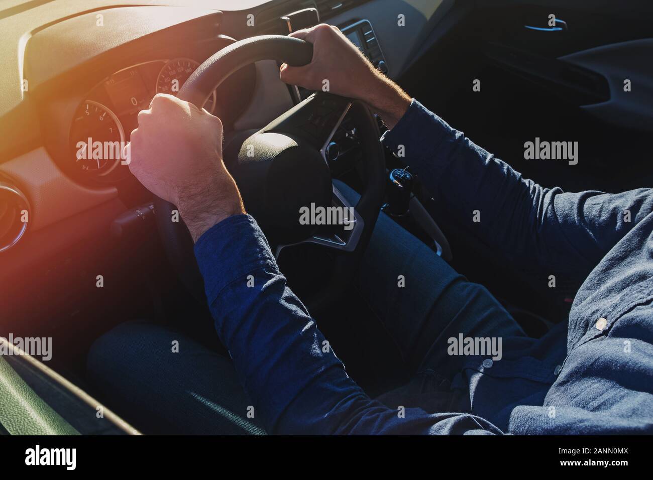 Mans hand holding steering wheel hi-res stock photography and images ...