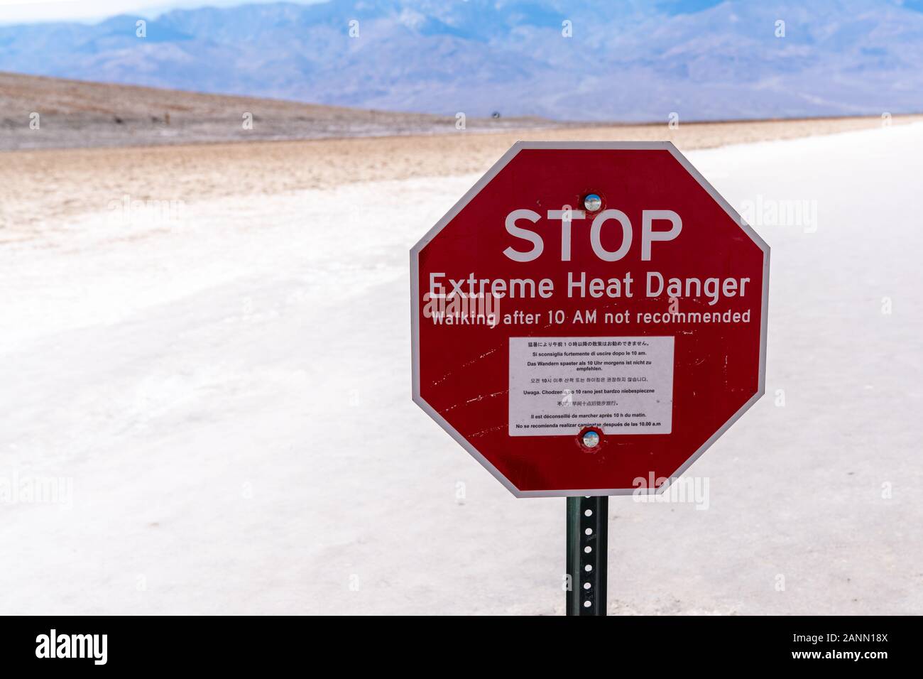 Extreme Heat Warning Sign at Badwater Basin in Death Valley, United States Stock Photo