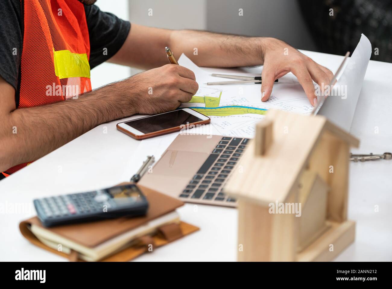 Young Man Construction Worker Or Engineer Working At Desk With Designer Equipment To Make Interior Design At Workplace Real Estate Business And Civil Stock Photo Alamy