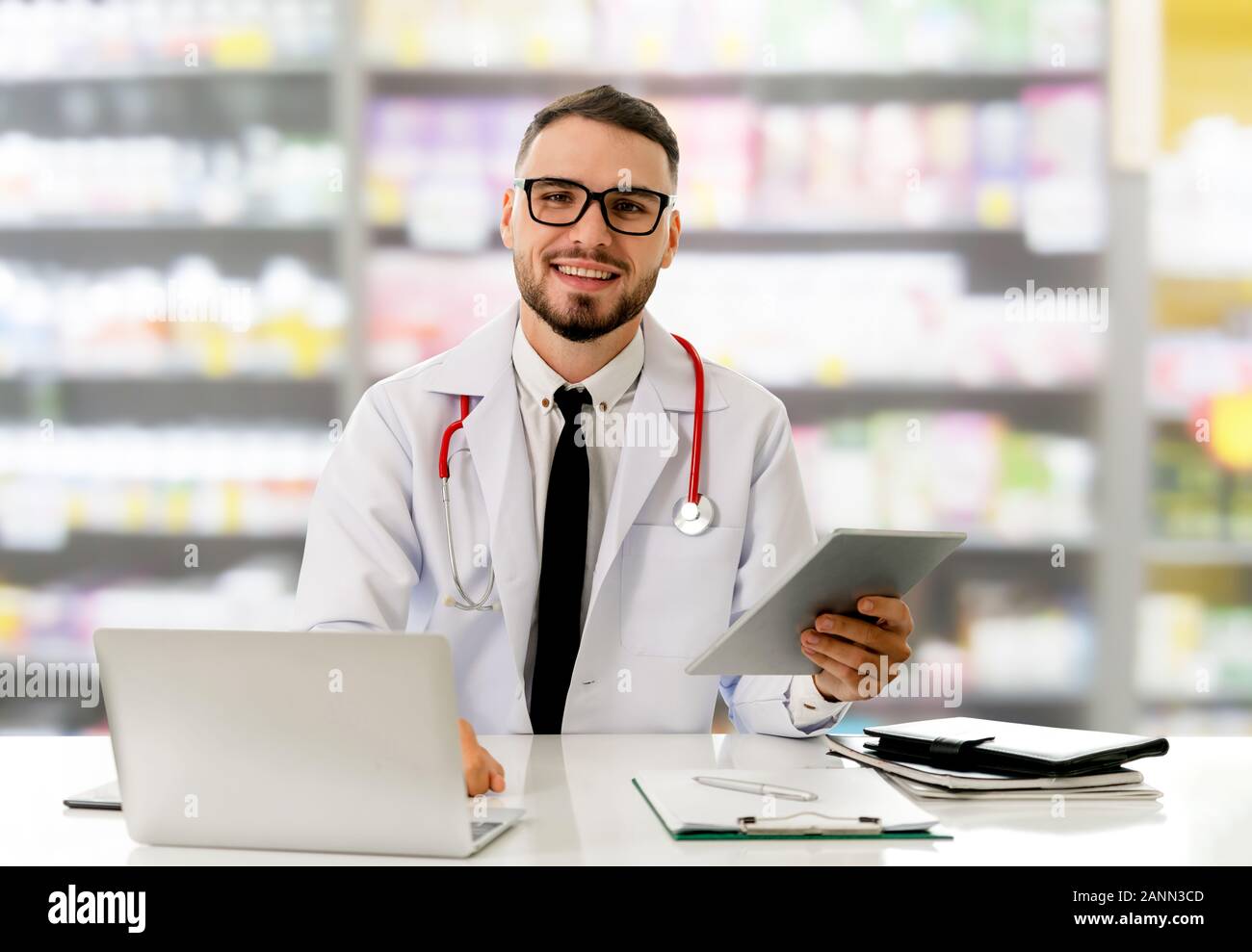 Pharmacist using tablet computer at the pharmacy. Medical healthcare