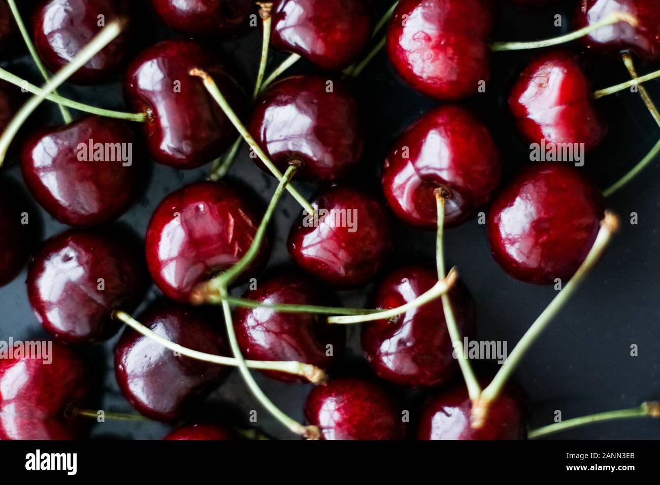 Organic food, vegan dieting and health concept - Fresh sweet cherries, juicy cherry berries fruit dessert as healthy diet background Stock Photo