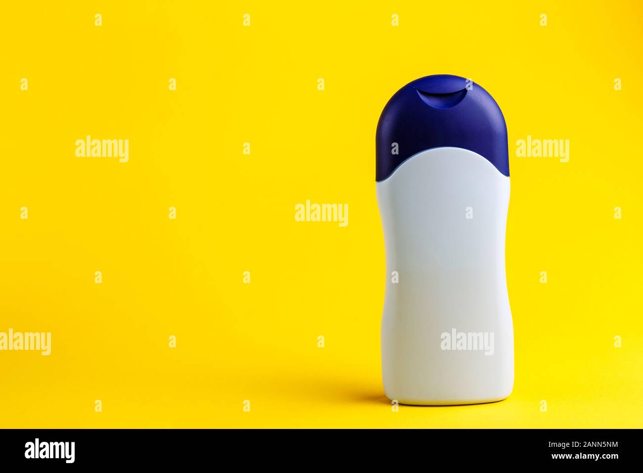 Download Blue Bottle With Body Oil On A Bright Yellow Background Place For Text Stock Photo Alamy Yellowimages Mockups