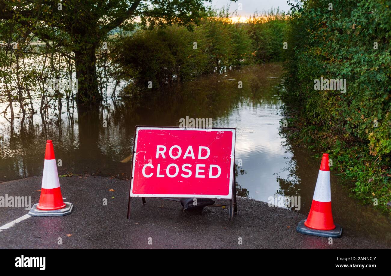 Road closed due to flooding in rural setting Stock Photo