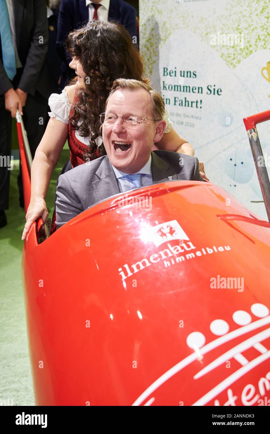 Berlin, Germany. 18th Jan, 2020. Bodo Ramelow (r, Die Linke), Prime Minister of Thuringia, and Petra Enders, District Administrator of the Ilm district in Thuringia, test the bobsleigh of the Ilmenau Himmelblau barn at the Green Week. Credit: Annette Riedl/dpa/Alamy Live News Stock Photo