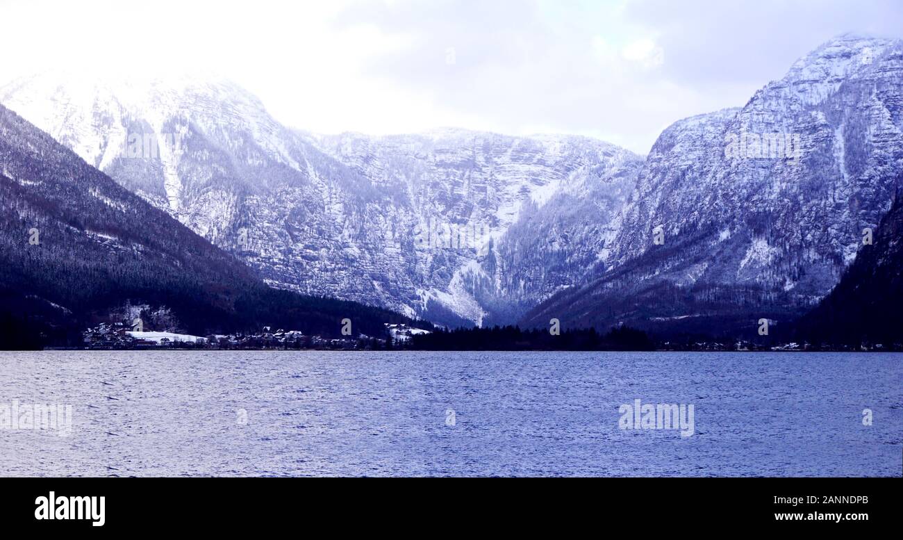 Panorama of Hallstatt lake outdoor dreamscape with snow mountain background blue tone in Austria in Austrian alps Stock Photo