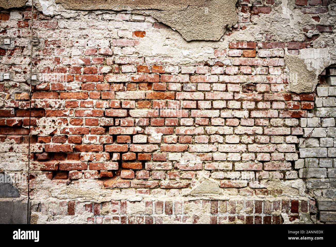 Old brick and plaster wall texture background. Painted distressed wall