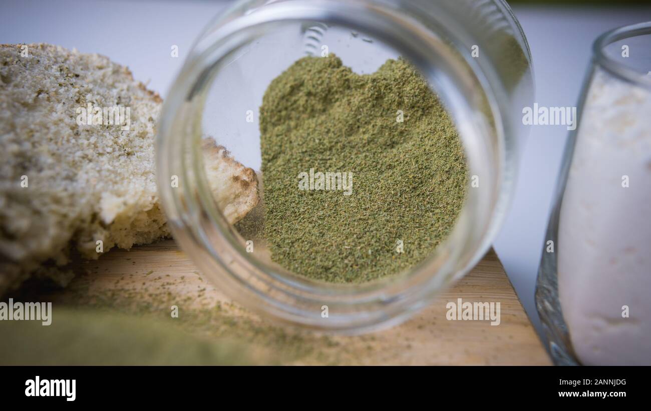 Close-up of bread with hemp flour, sandwich with cannabis butter and hashish. Concept of using marijuana in the food industry Stock Photo