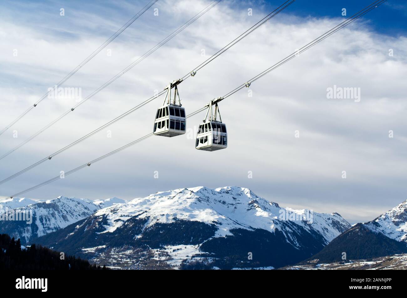 The double deck cable cars of the Vanoise Express passing on the crossing between Les Arcs and La Plagne. Stock Photo