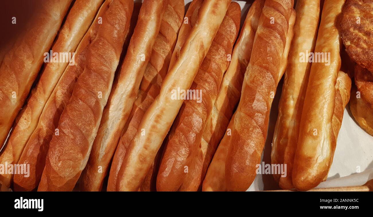 fresh rosy appetizing baguettes close up Stock Photo