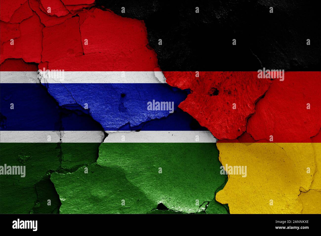 flags of Gambia and Germany painted on cracked wall Stock Photo