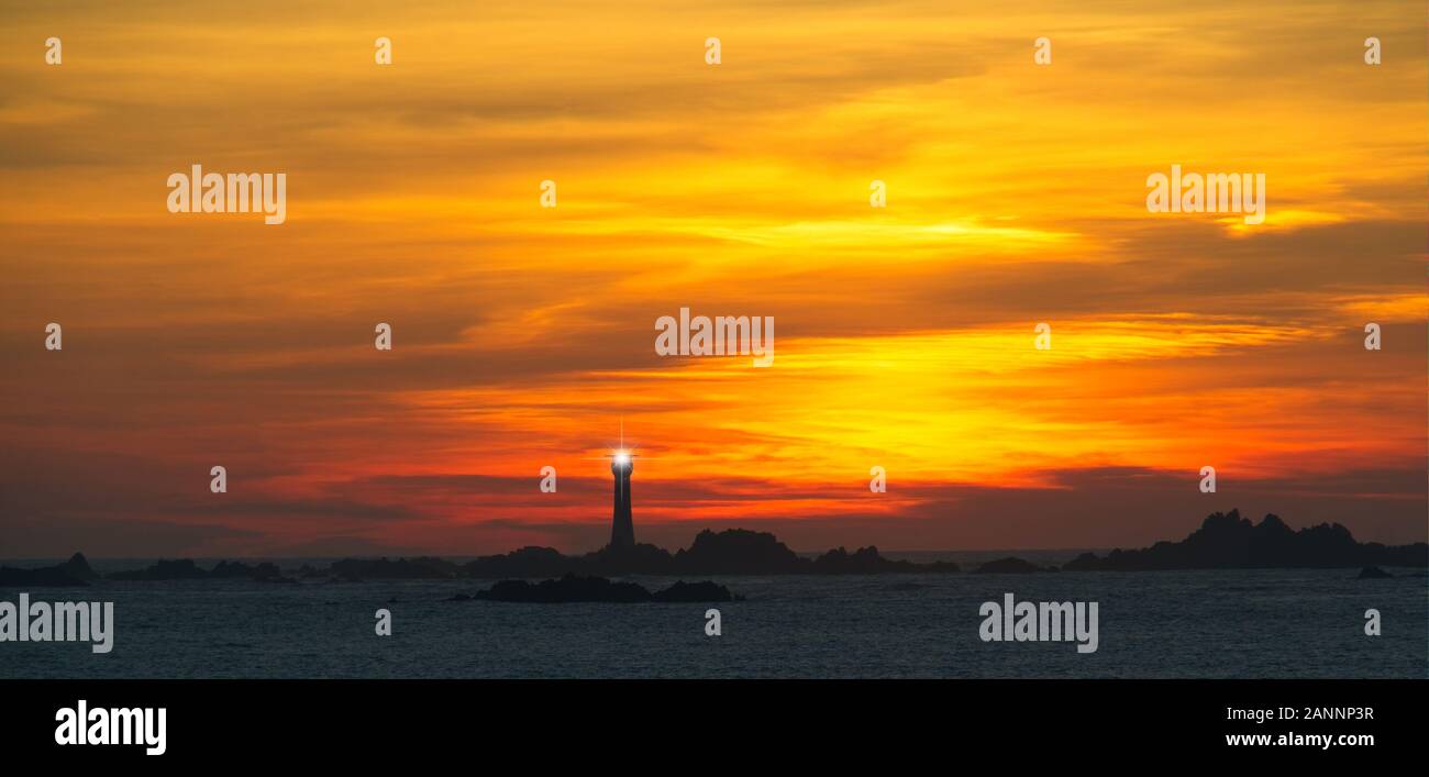 Serene sunset Les Hanois reef, southwest Guernsey Stock Photo