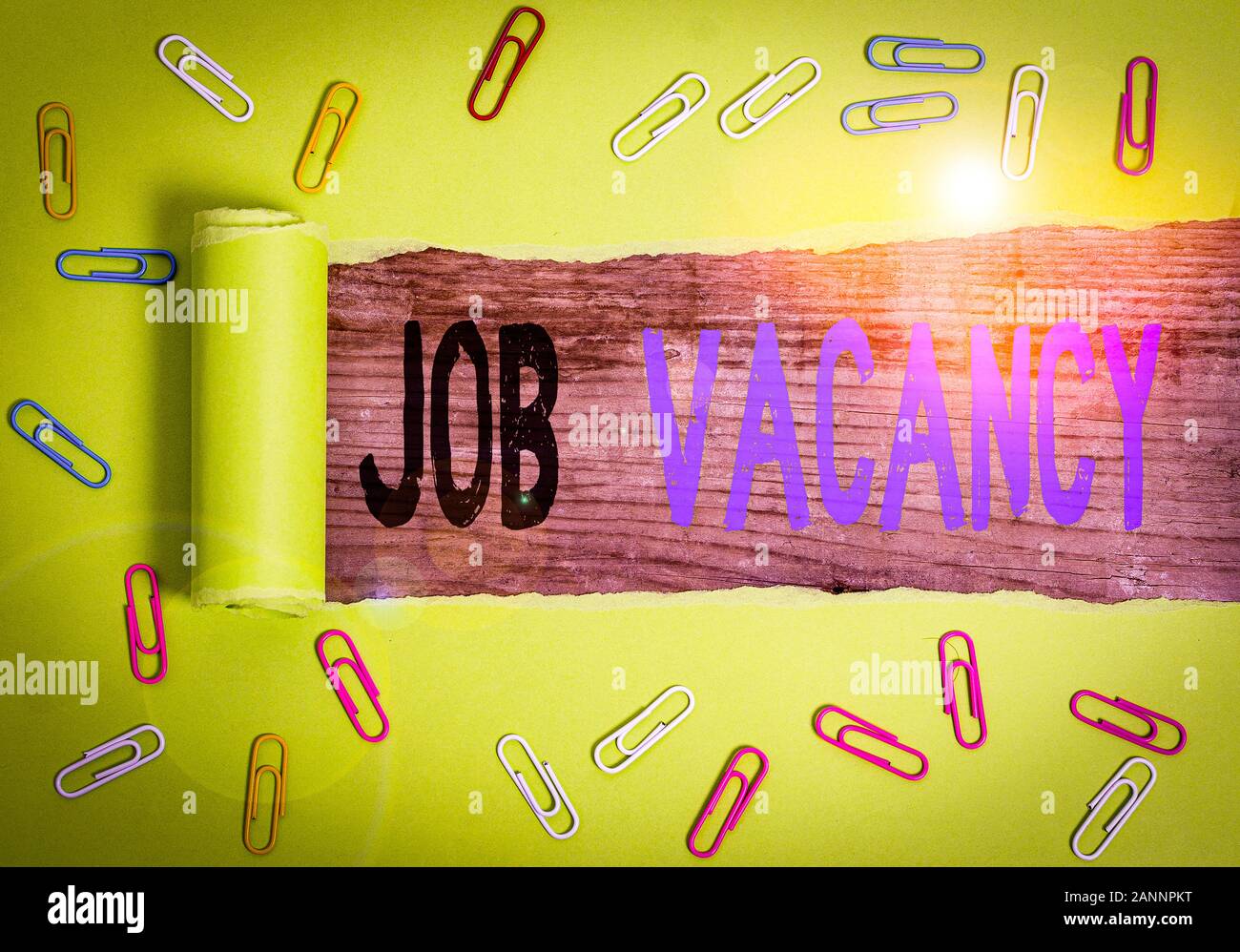 Text sign showing Job Vacancy. Business photo text job that no one is doing and available for someone to do Paper clip and torn cardboard placed above Stock Photo