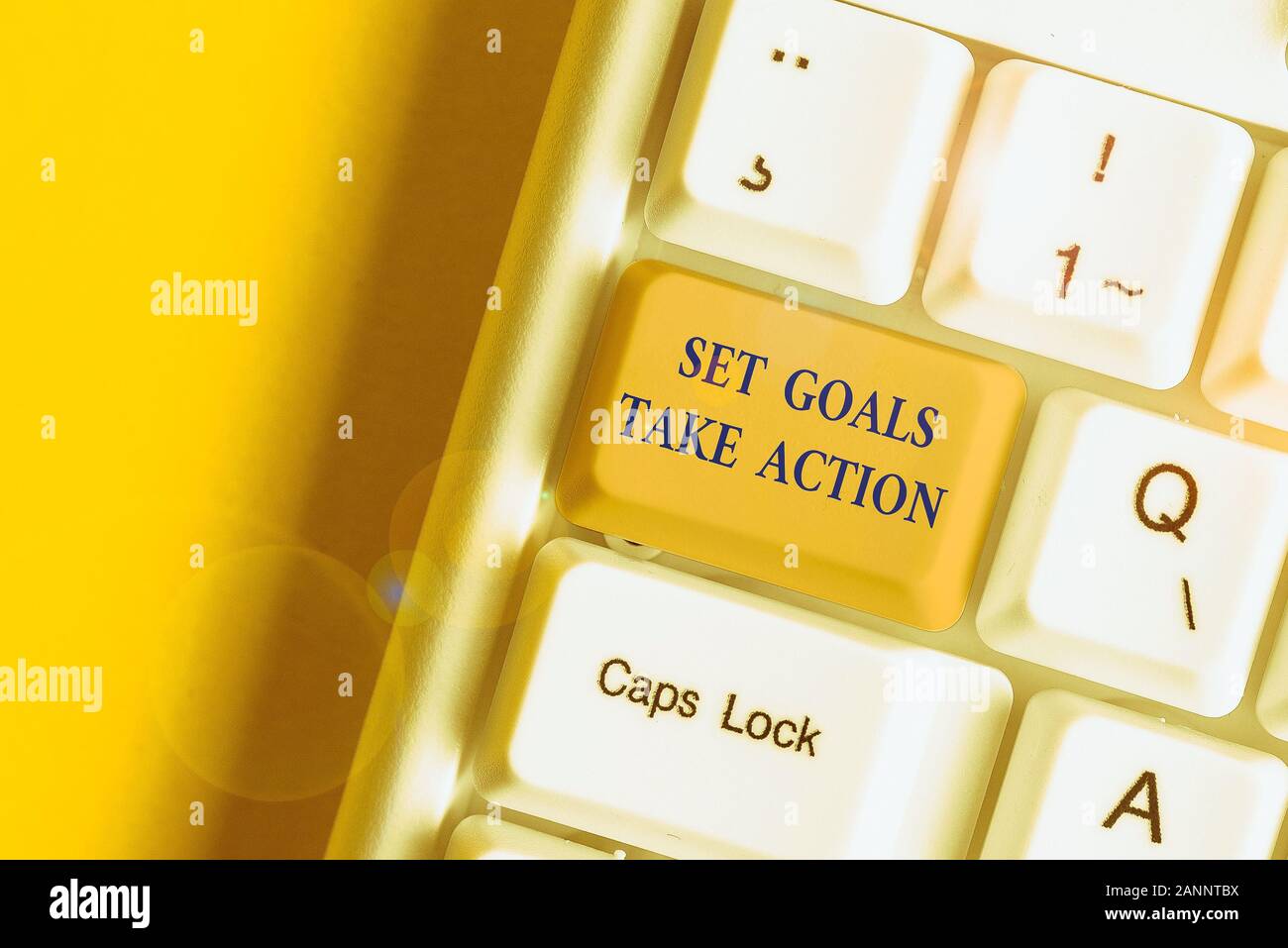 Writing note showing Set Goals Take Action. Business concept for Act on a specific and clearly laid out plans White pc keyboard with note paper above Stock Photo