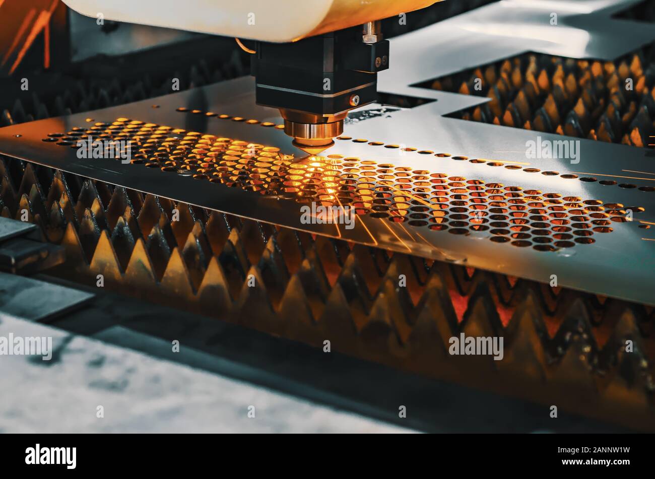 High precision CNC laser cutting metal sheet. Stock Photo