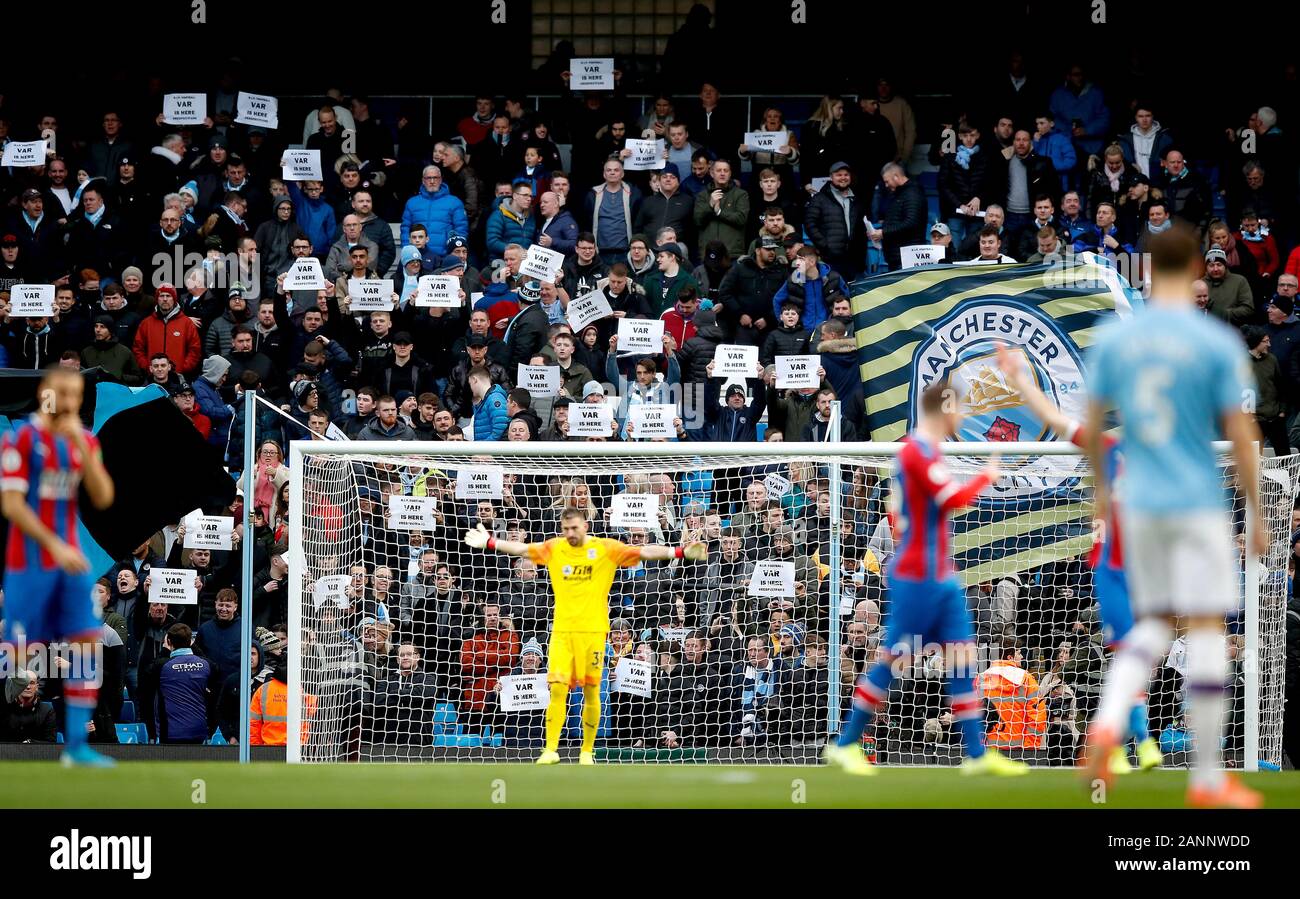 Football fans hold up anti-VAR signs in the stands during the Premier ...