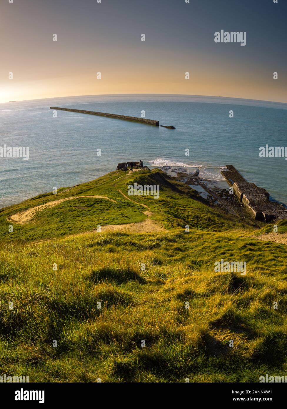 Elevated view of an ancient military pier leading into the water at Pointe de la Crèche Stock Photo
