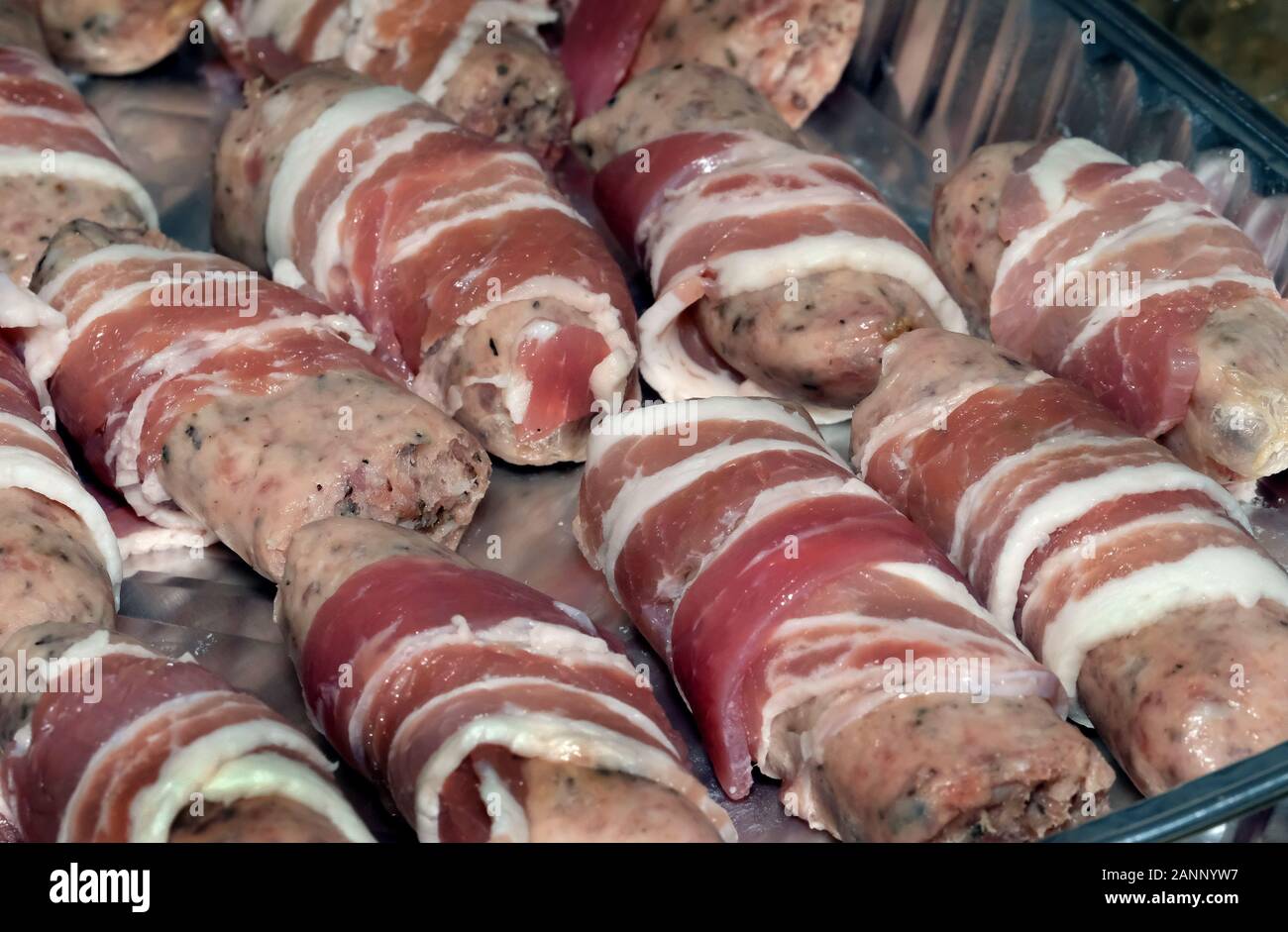 Pigs in blankets ready for the celebration dinner. Pork meat and bacon. Stock Photo
