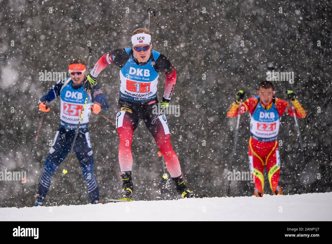Ruhpolding, Germany. 18th Jan, 2020. Biathlon: World Cup, relay 4 x 7.5 km, men in the Chiemgau Arena. Johannes Dale from Norway (M) runs ahead of Timofei Lapshin from South Korea (l) and Fangming Cheng from China. Credit: Matthias Balk/dpa/Alamy Live News Stock Photo