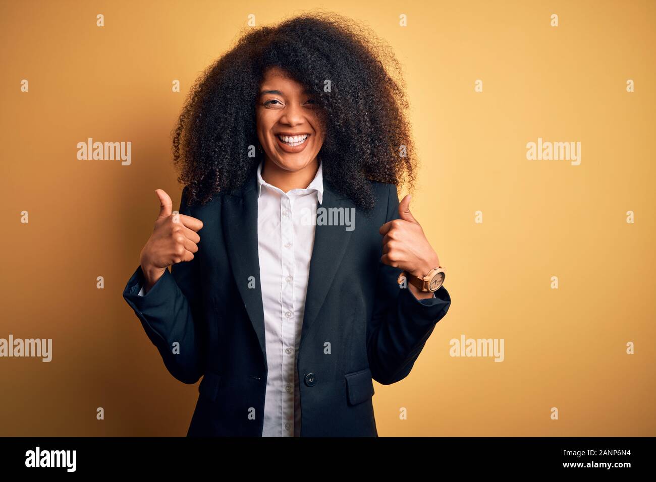 Young beautiful african american business woman with afro hair wearing ...
