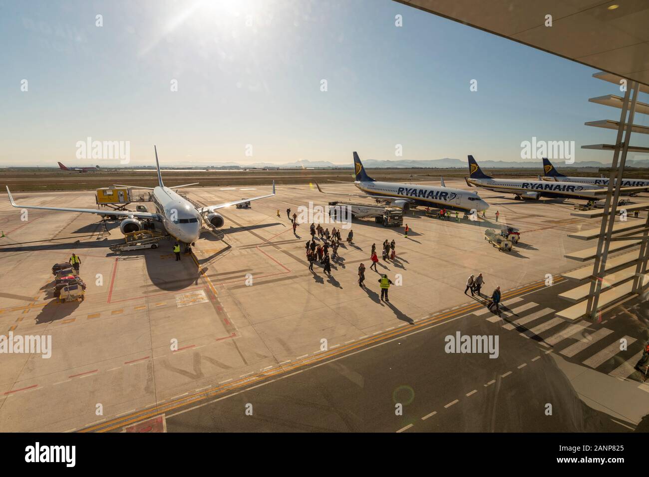 Region de Murcia International Airport, Corvera, Costa Calida, Spain, Europe. Busy with easyJet and Ryanair jet airliner planes. Passengers exiting Stock Photo
