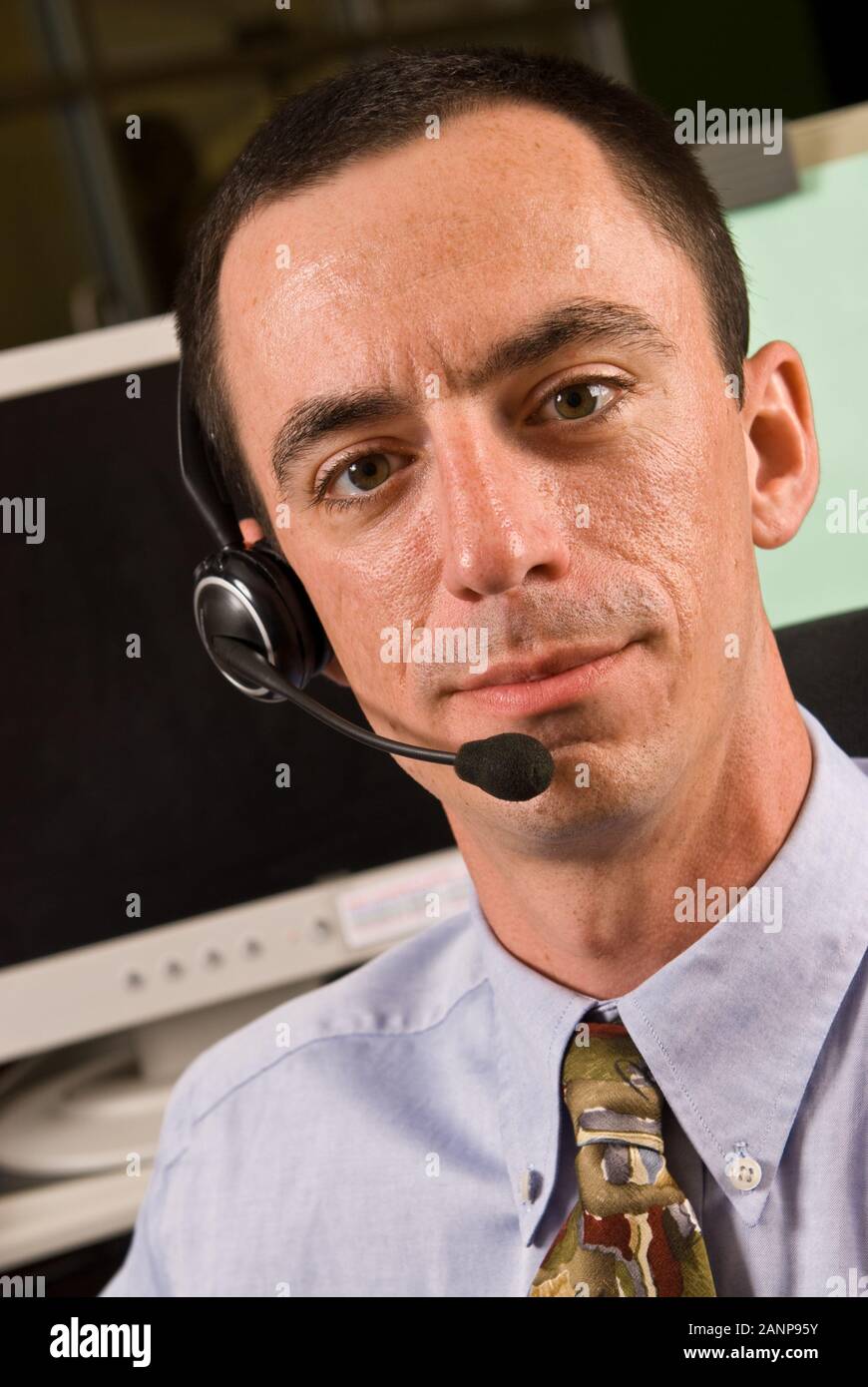 Male office worker wearing handsfree phone headset Stock Photo Alamy