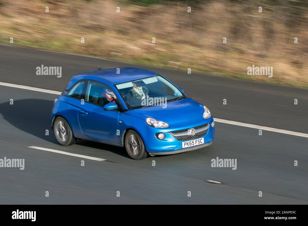 2015 Vauxhall Adam Jam Blue Car Petrol driving on the M6 motorway near Preston in Lancashire, UK Stock Photo