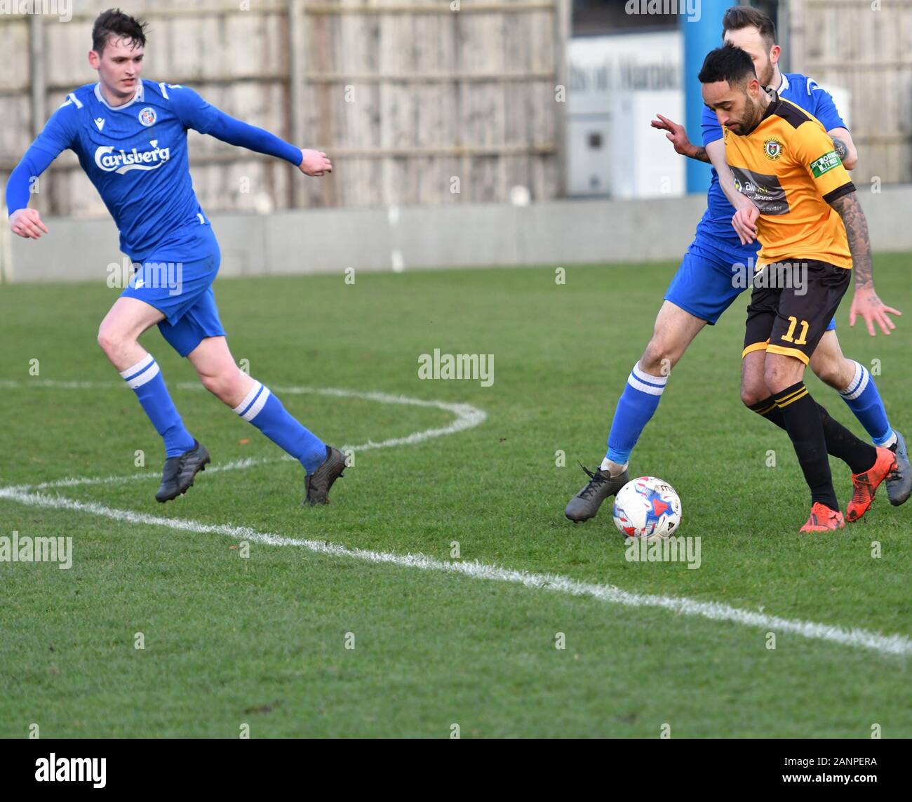 New Mills, Derbyshire  January 18th 2020 Action from the North West Counties League m (amber and black) and Wythenshawe Town (blue).Wythenshawe win 4-2. Stock Photo
