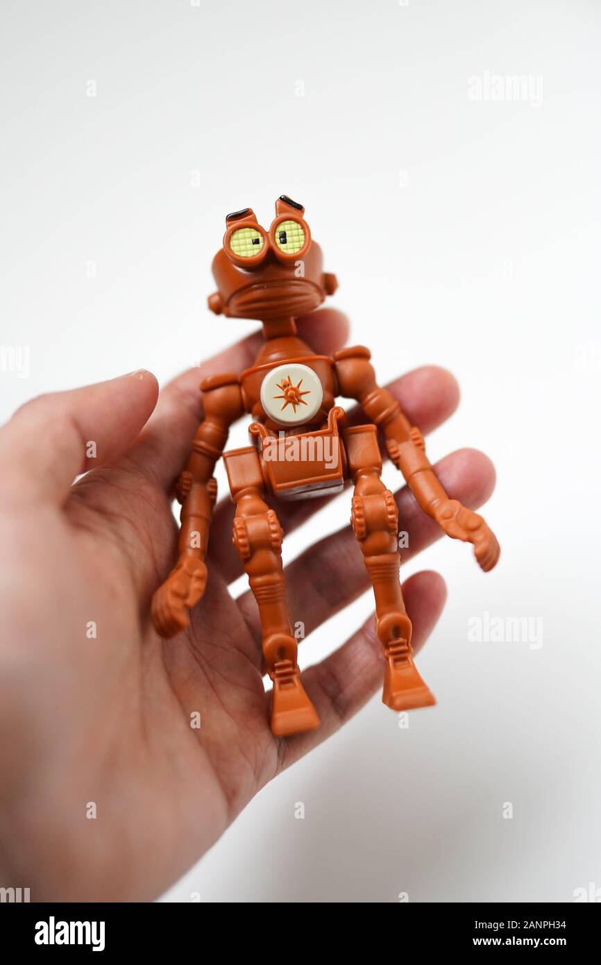 a small brown robot kids toy from mcdonalds Stock Photo - Alamy