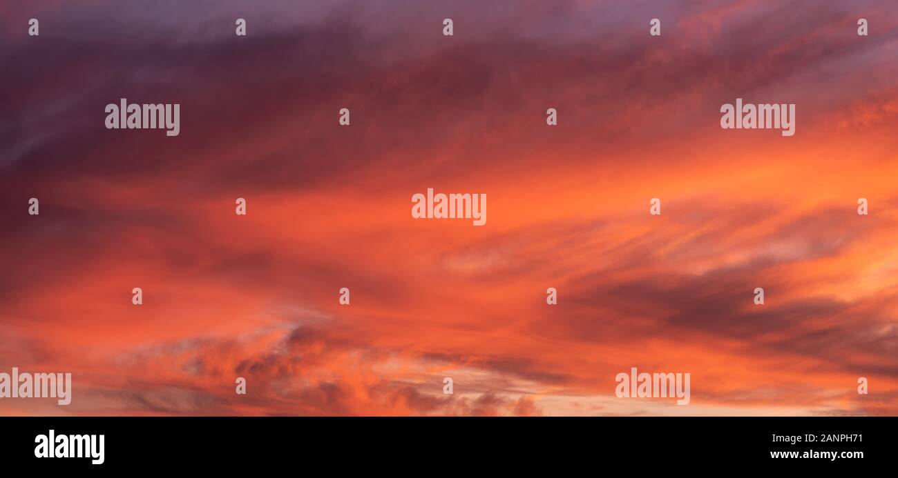 Colorful sunset sky background with reddish colors Stock Photo - Alamy