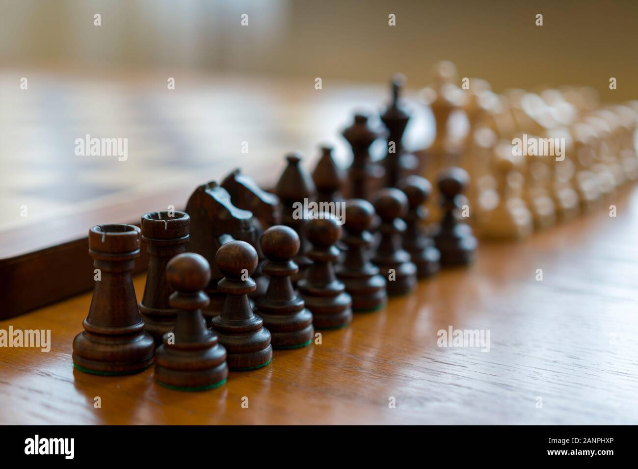 Chess pieces in front of a chessboard Stock Photo - Alamy