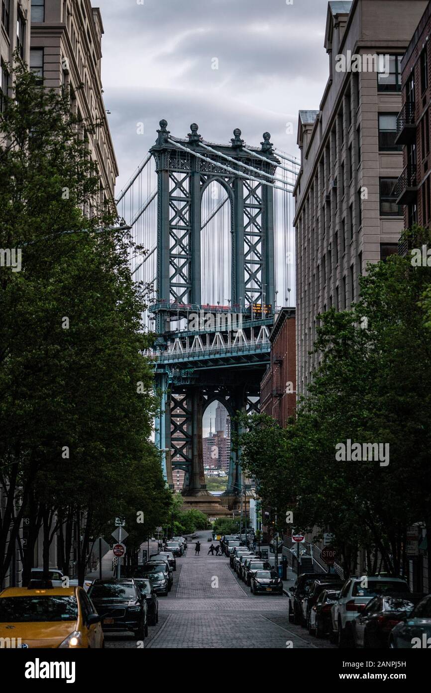 View of one of the towers of the Manhattan Bridge from the streets of the DUMBO district, Brooklyn, NYC Stock Photo